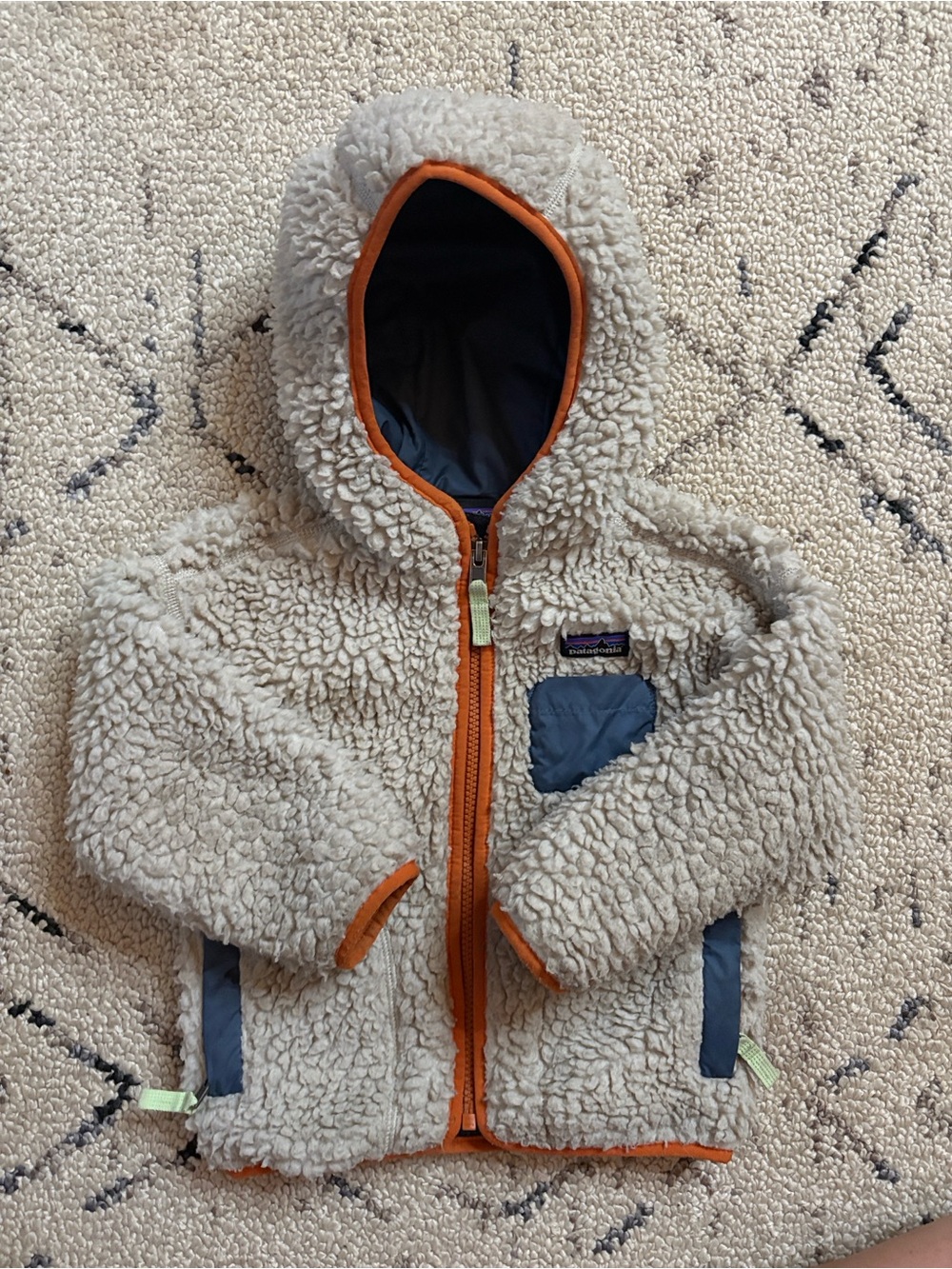 Patagonia Kids Cream Sherpa Hoodie with Orange Trim and Navy Accents